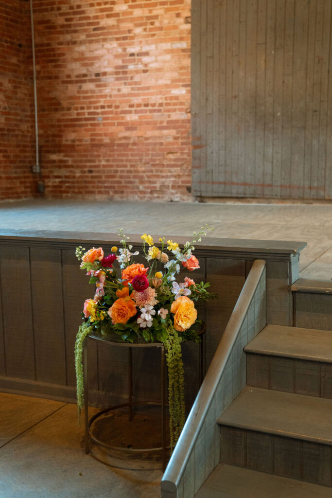 Colorful wedding flowers at Empire Mills ceremony.